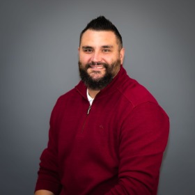 Young man with beard wearing a red shirt