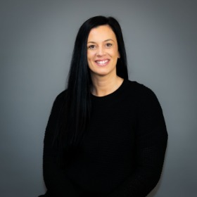 Long black-haired woman wearing a black shirt