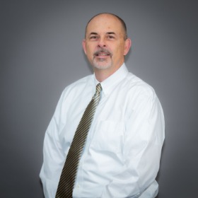 Man wearing a white shirt with a tie