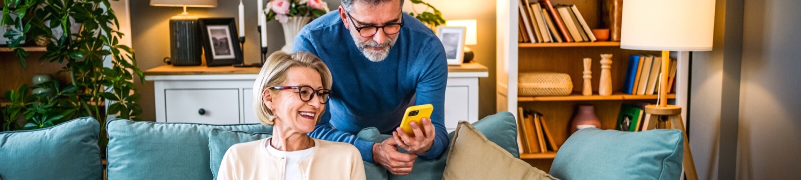 mature couple looking at a smartphone